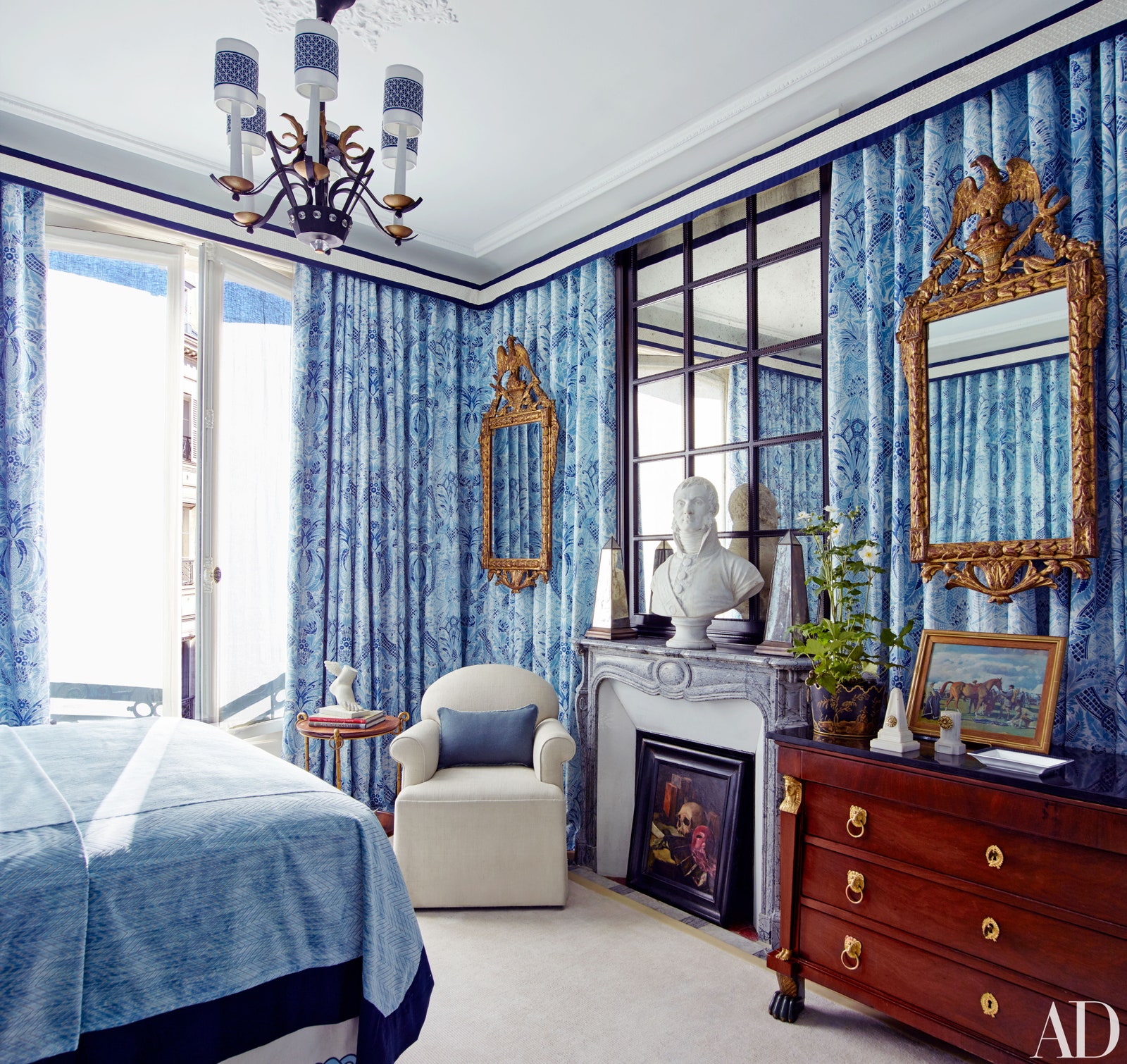 Image may contain Furniture Indoors Room Bedroom Living Room Interior Design Human Person Bed and Cabinet